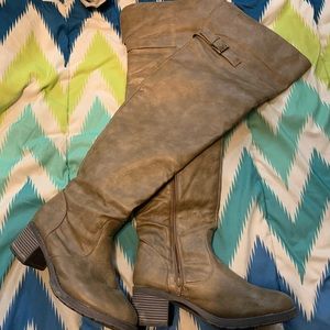 Thigh high brown leather boots